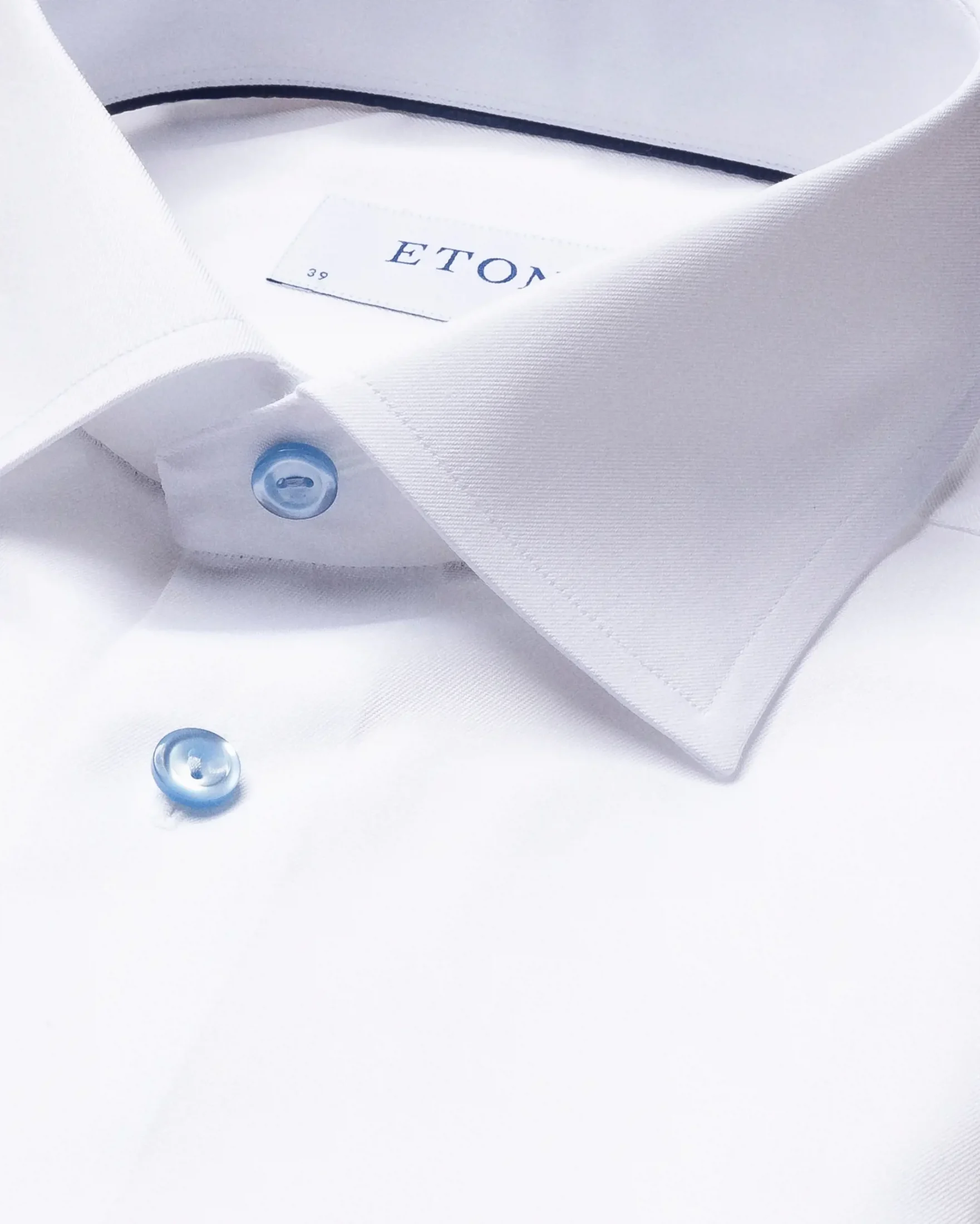 white-twill-shirt-blue-details-cutaway_2023-07-19T095609539Z