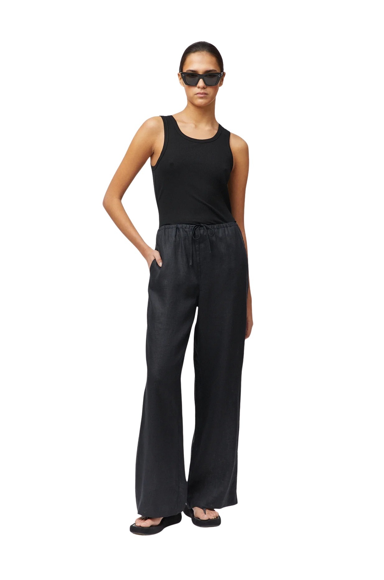 fwss_summer_2025_campaign_trine_hisdal_riviera_ribbed_tank_jet_black_linen_siena_trousers_c3d34262-3cf2-4dfd-bf2d-35558fe05edc